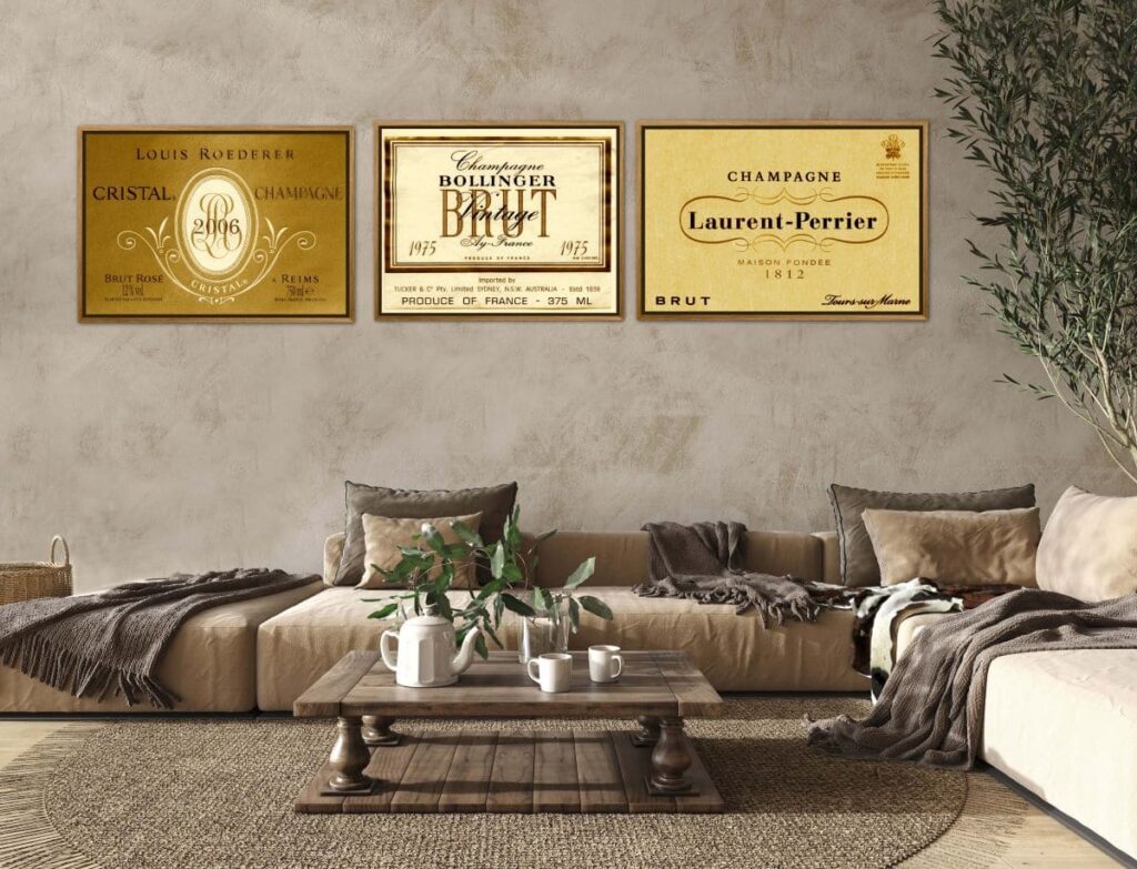 Three framed champagne labels on a wall in a lounge