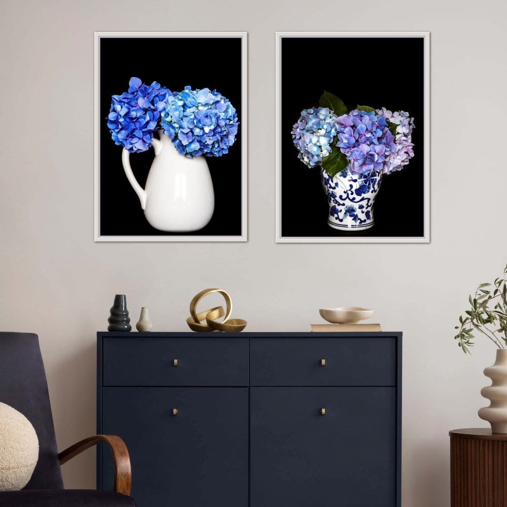 Two framed images of blue hydrangeas in vases