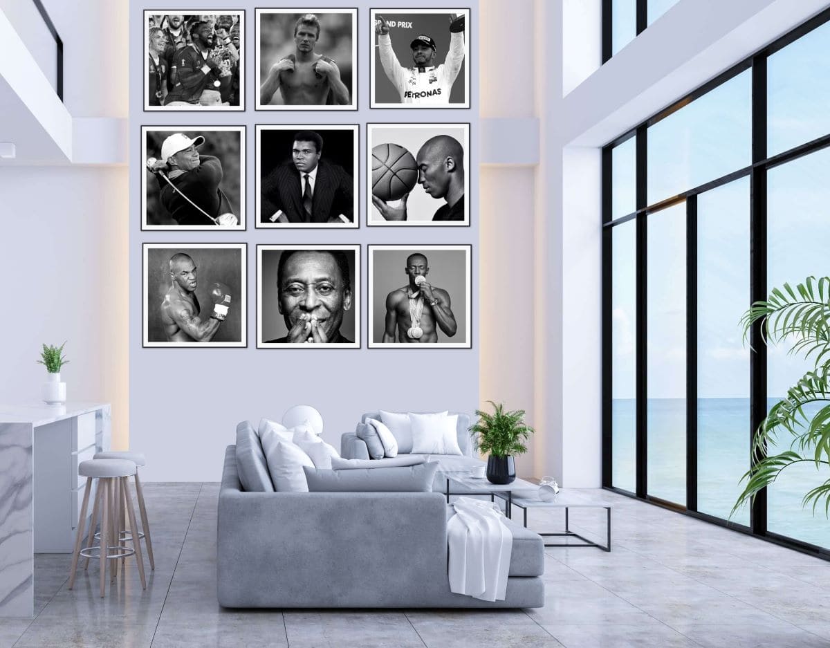 9 framed black and white pictures of sports stars hanging on wall in a smart lounge