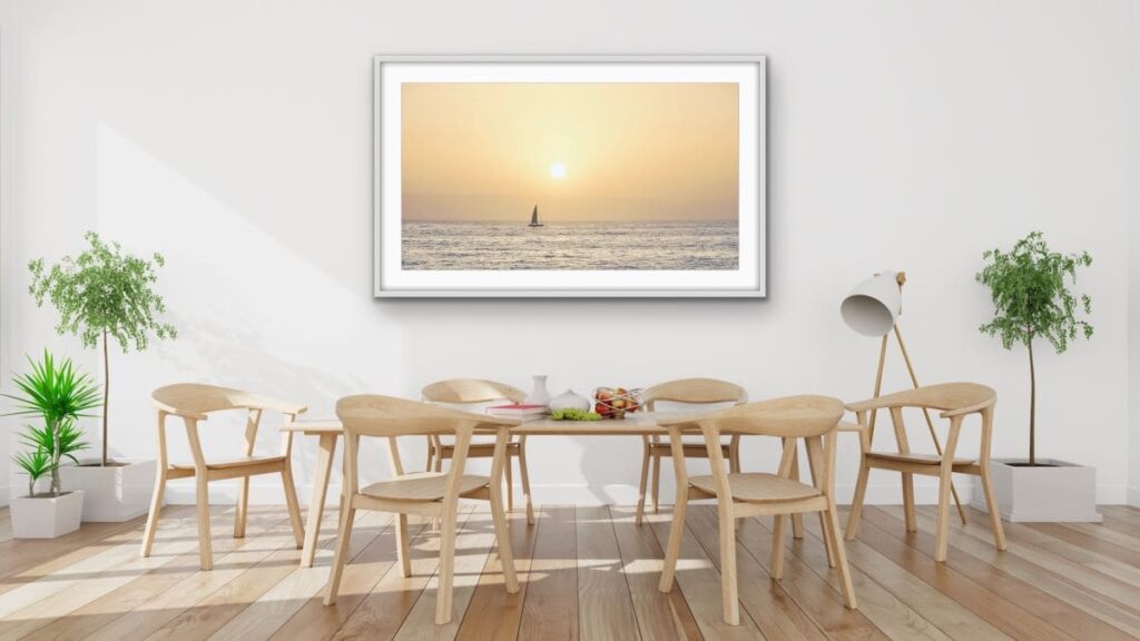 Framed art on a dining room wall