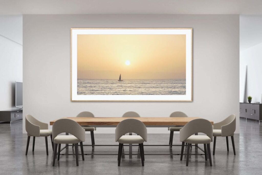 Framed art on a dining room wall