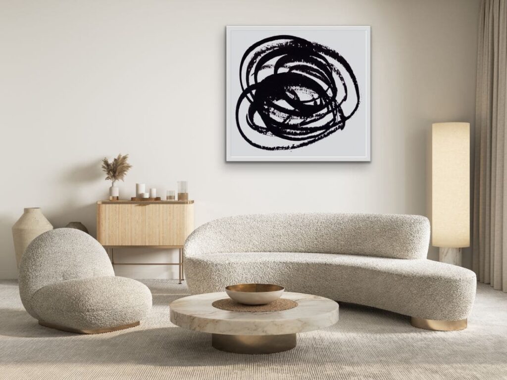 Framed abstract art hanging on wall in deco lounge